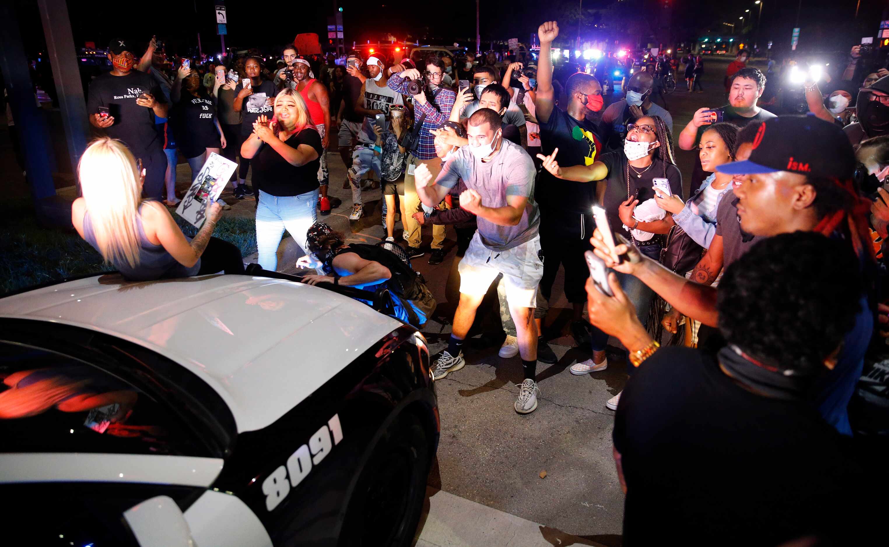Protestors stop Dallas Police officers responding to a confrontation at Young St. and S....