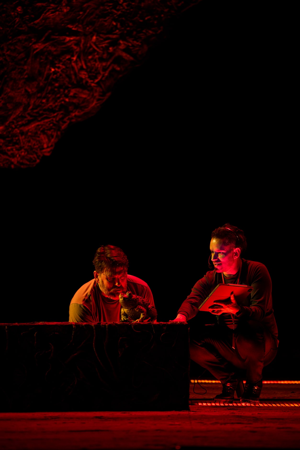 Baritone Michael Mayes listens as assistant director Gregory Boyle explains the desired prop...