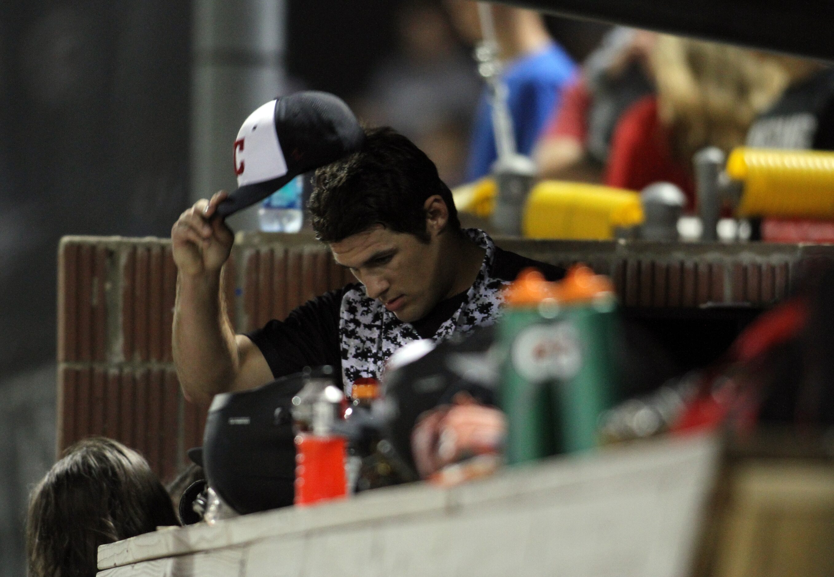 Carrollton Creekview pitcher Brandon White (15) removes his cap in the team dugout after...