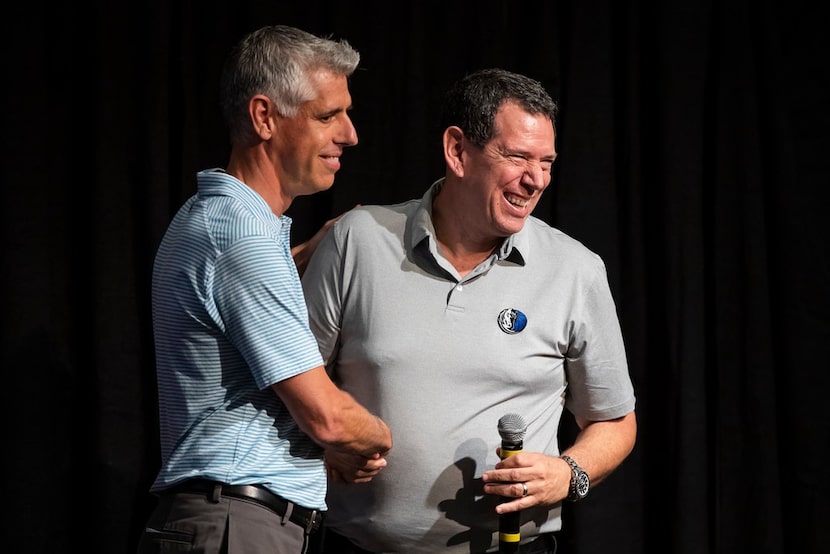 Broadcaster Craig Miller of The Ticket (left) greets Dallas Mavericks play-by-play...