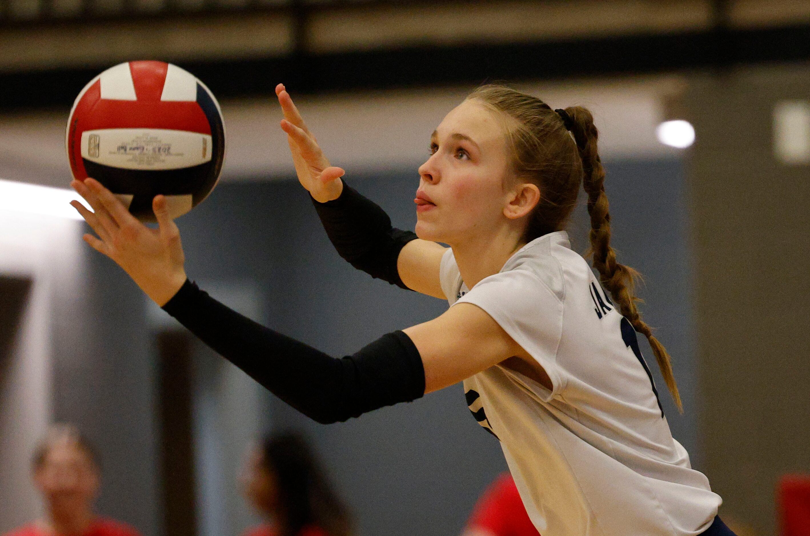 Flower Mound's Hayden Curtis (15) serves against Coppell during a high school girl’s...