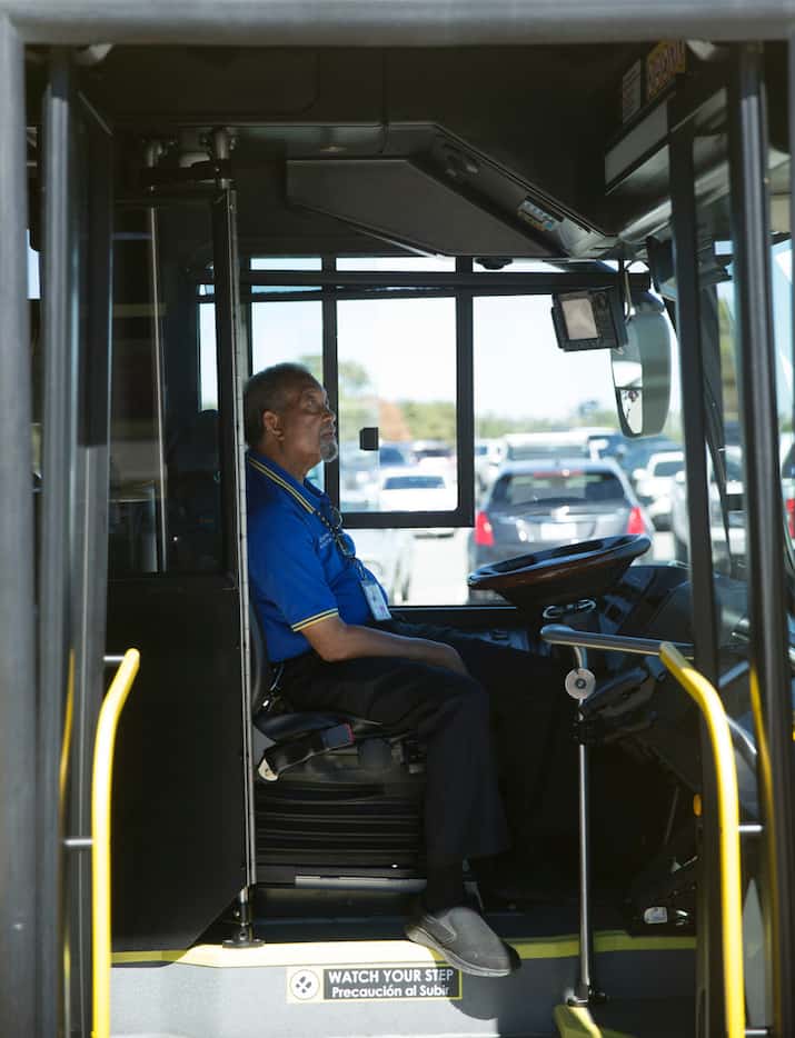 Joseph Hawthorne, DART bus operator instructor, sitting on the driver's seat of a Proterra...