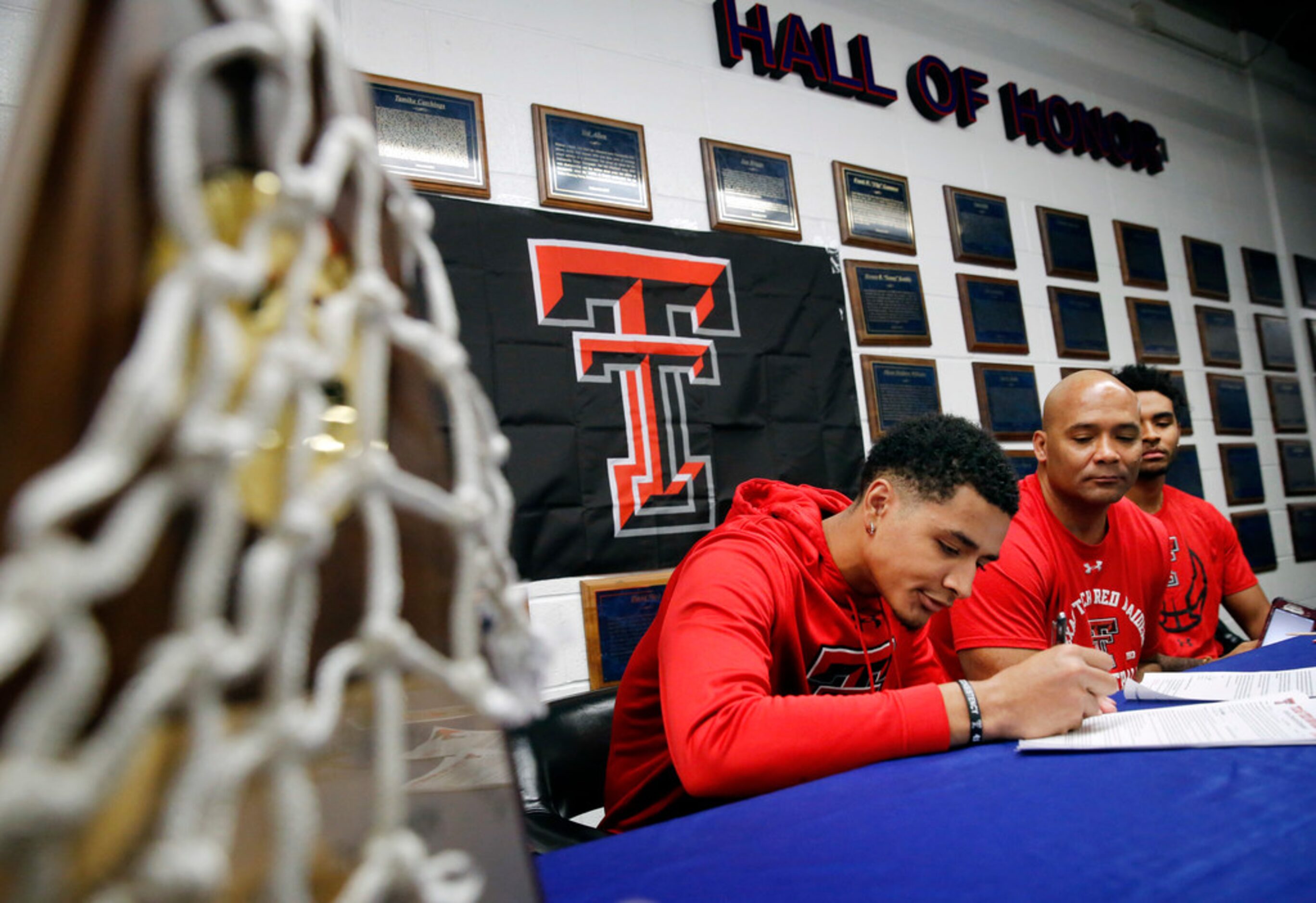 Alongside his father and head coach David Peavy (second from right), Duncanville boys...