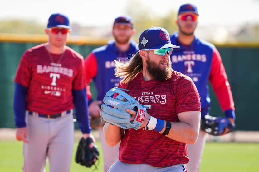 Infielder Davis Wendzel makes a throw during a Texas Rangers minor league spring camp...