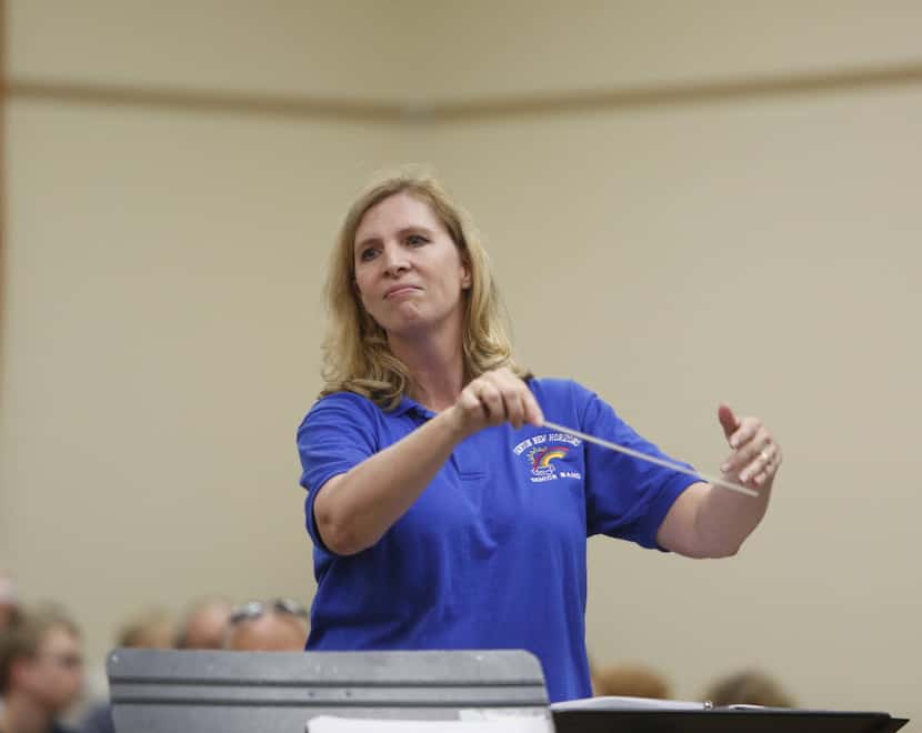 Debbie Rohwer conducts the New Horizons Band during a performance at the Denton Senior Center.