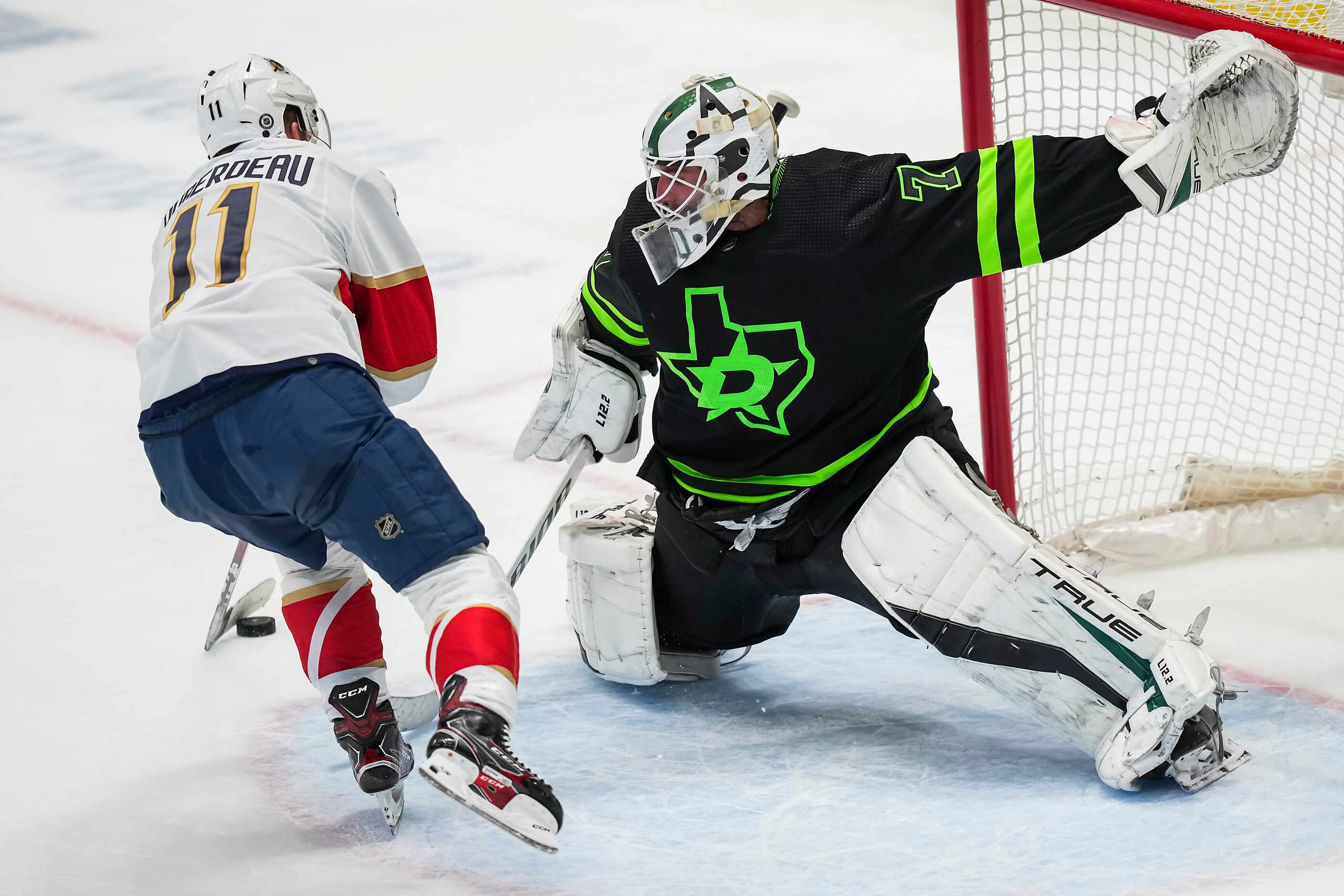 Dallas Stars goaltender Braden Holtby (70) turns away Florida Panthers left wing Jonathan...