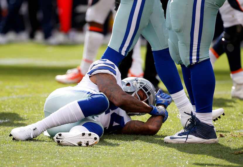 Dallas Cowboys cornerback Nolan Carroll (24) reacts after getting hurt during a tackle...