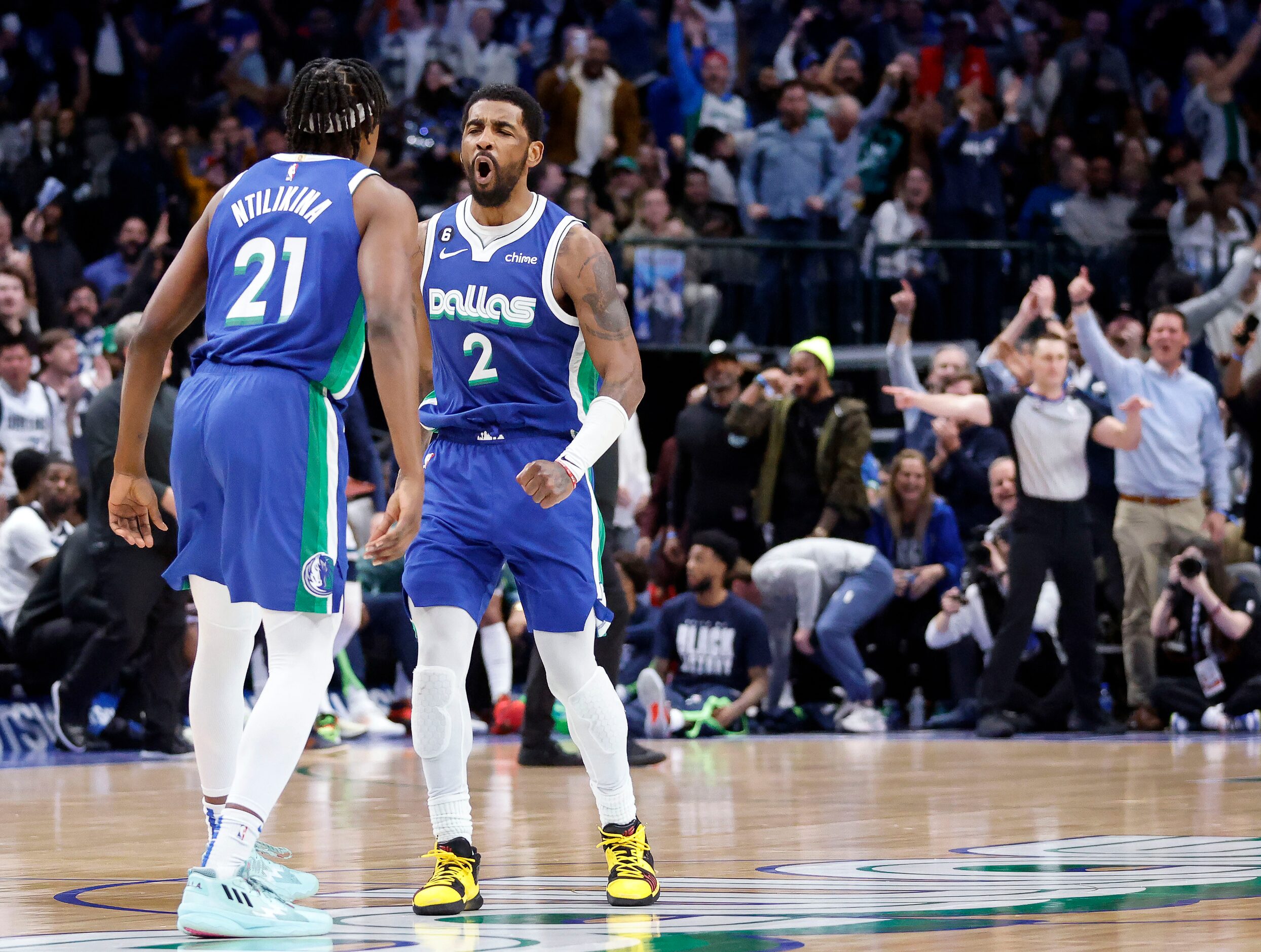 Dallas Mavericks guard Kyrie Irving (2) celebrates his fourth quarter three-pointer with...