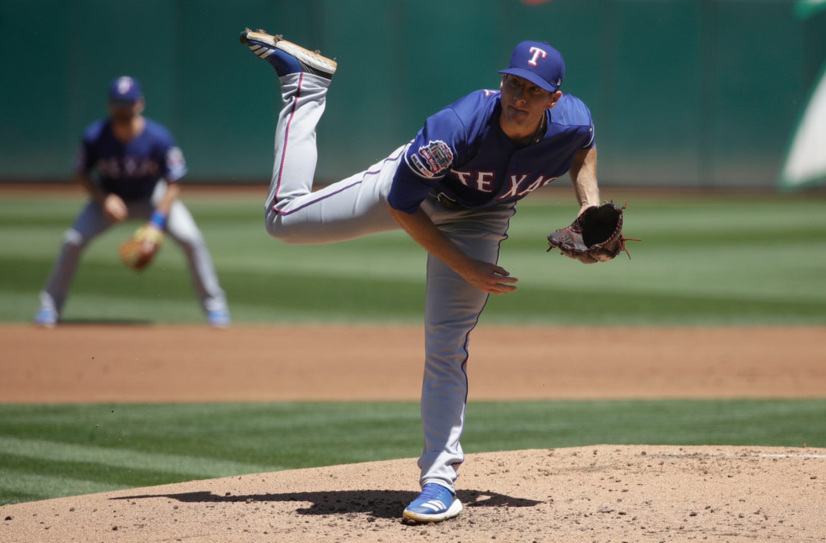 Texas Rangers pitcher Kyle Dowdy throws against the Oakland Athletics during the first...