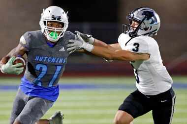 Wilmer Hutchins’ RB Zadrian Turner (21) escapes Frisco Panther Creek defender Seth Jackson...