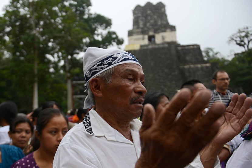 A Mayan shaman takes part in a ceremony at the Tikal archaeological site in Guatemala on...