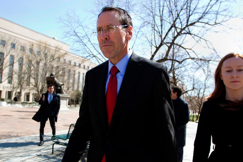 FILE - In this March 22, 2018, file photo, AT&T CEO Randall Stephenson leaves the federal...