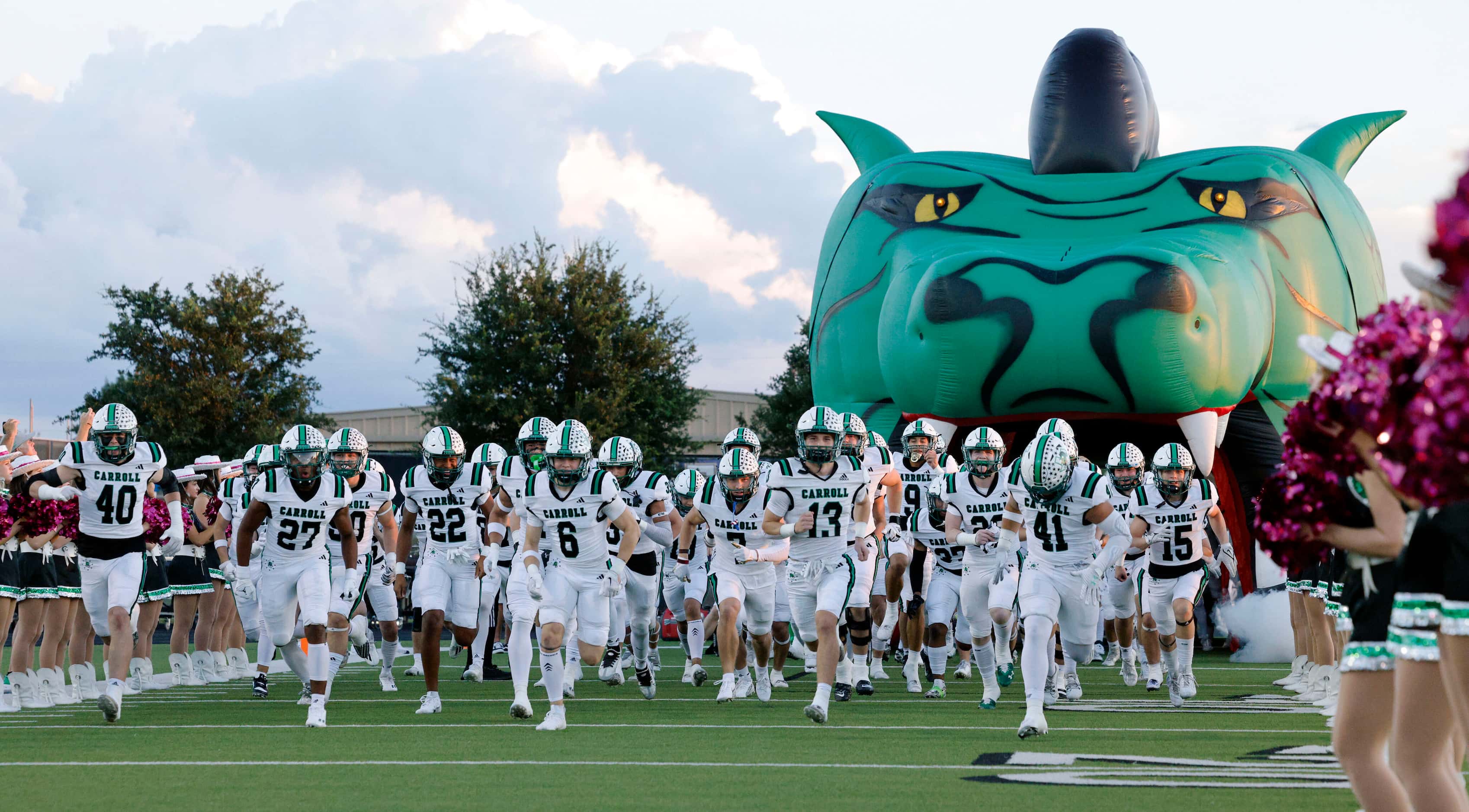 Southlake Carroll takes the field before the first half of a District 4-6A game against...