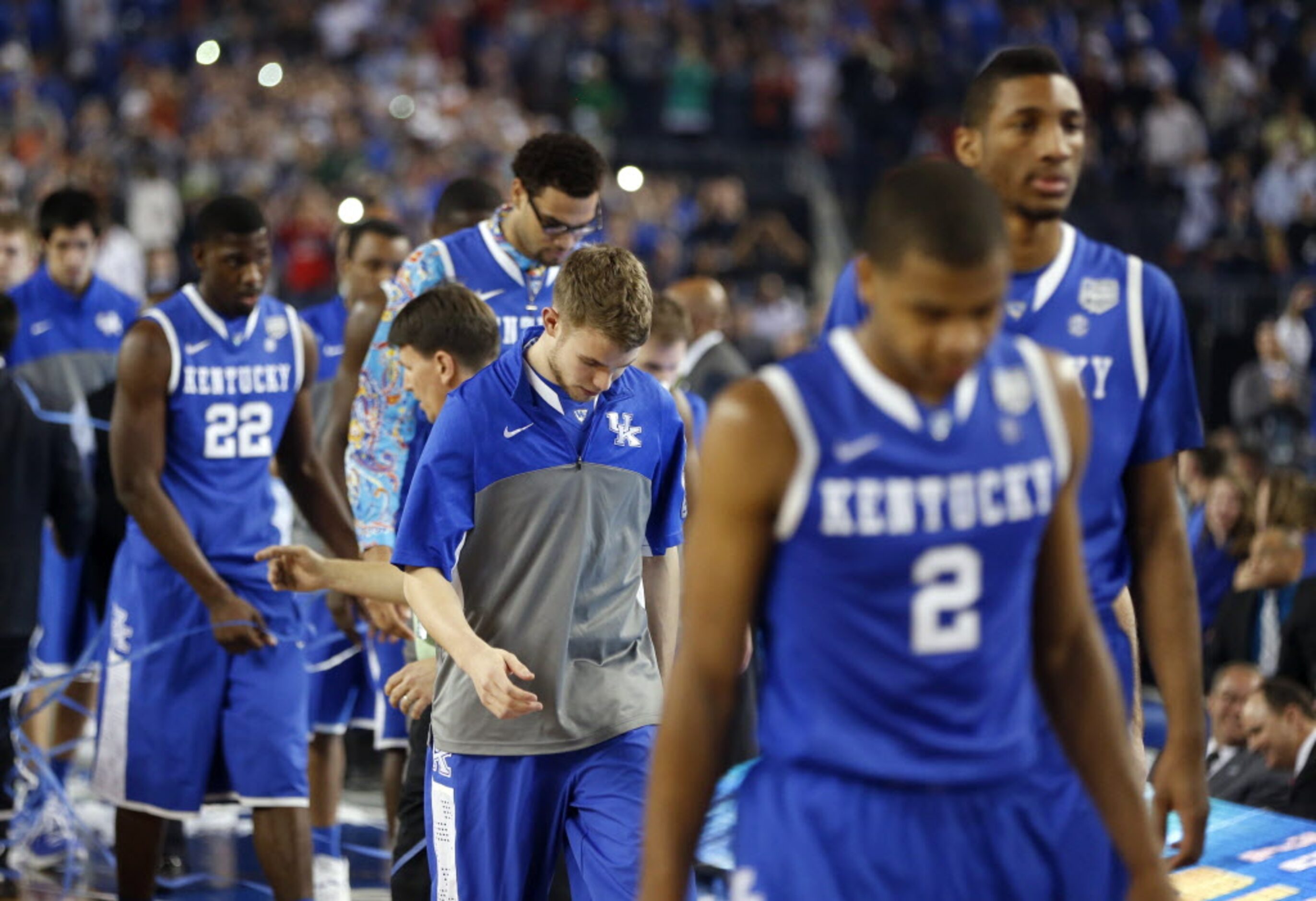 Kentucky Wildcat players walk off the court following a 60-54 loss to the Connecticut...