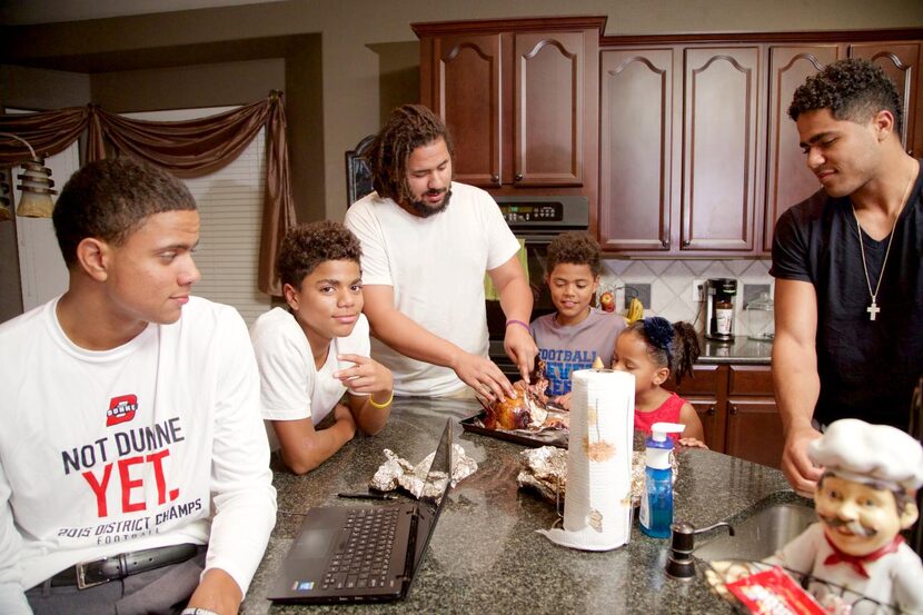 
Caleb Evans (left), 17, and his siblings Simeon, 13, Trey, 27, Titus, 10, Naomi, 6, and...