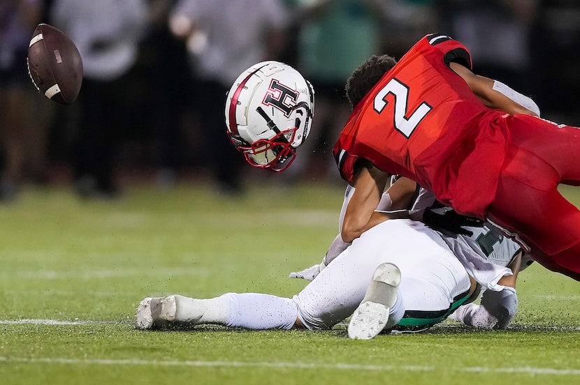 Rockwall-Heath wide receiver Jordan Nabors (2) lost his helmet when Southlake Carroll...