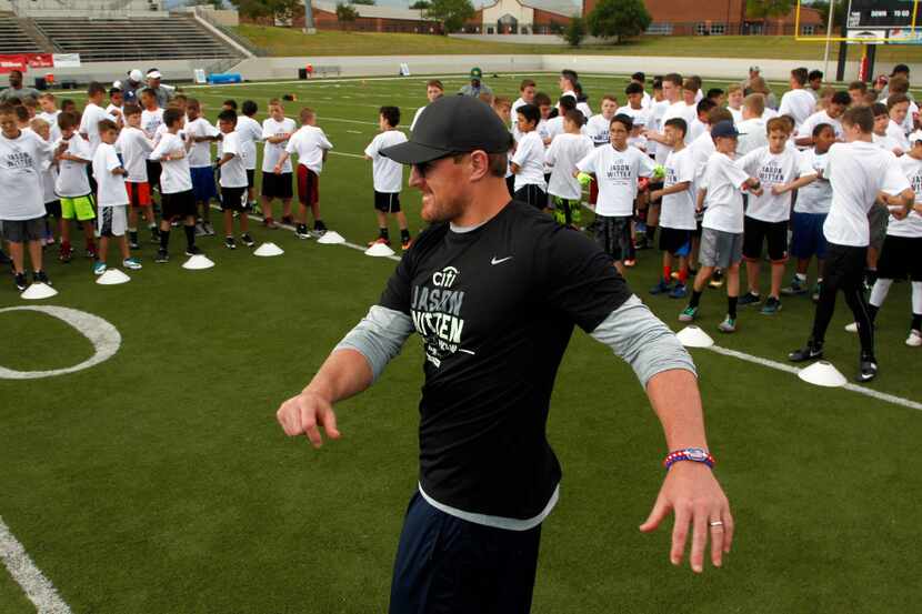 Jason Witten stretches with campers  during the Jason Witten Football ProCamp at Northwest...