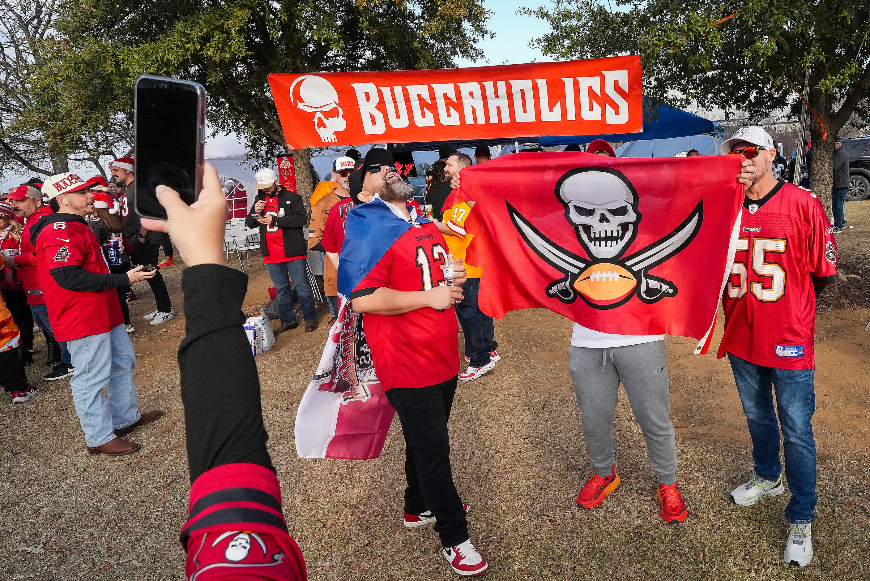 Tampa Bay Buccaneers fans tailgate before an NFL football game against the Dallas Cowboys at...