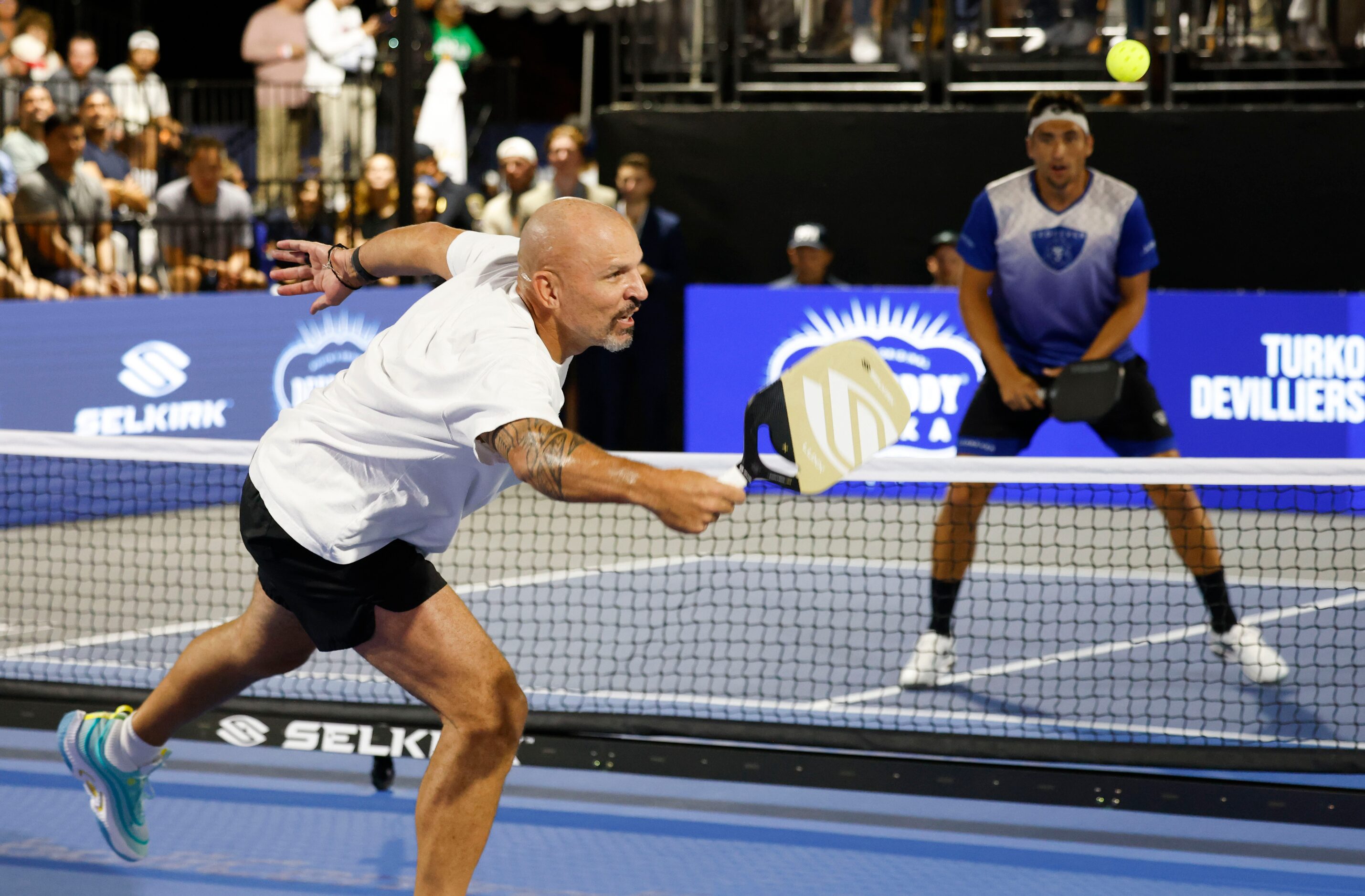 Dallas Mavericks head coach Jason Kidd (left) returns against Jay Devilliers during...