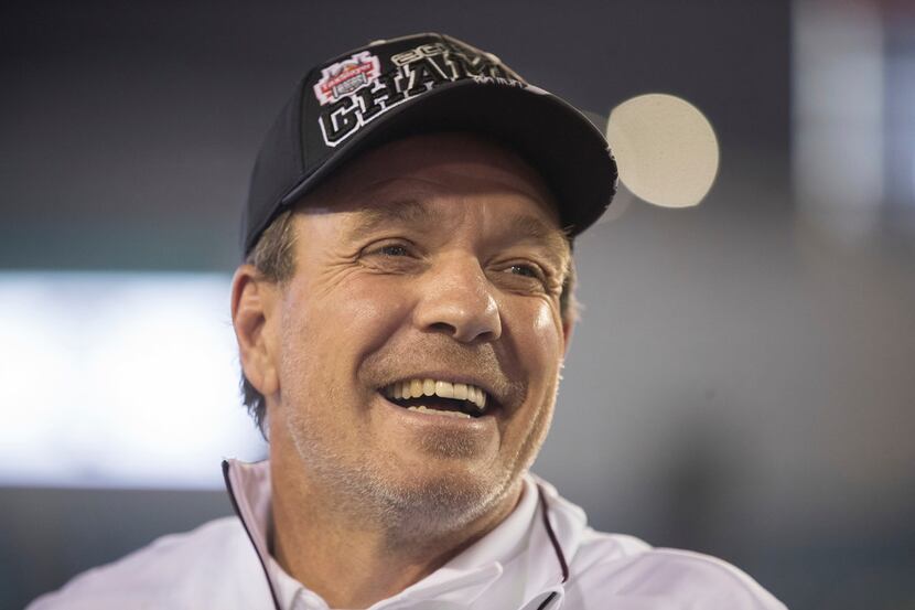 Texas A&M coach Jimbo Fisher smiles after the team's 52-13 win over North Carolina State in...