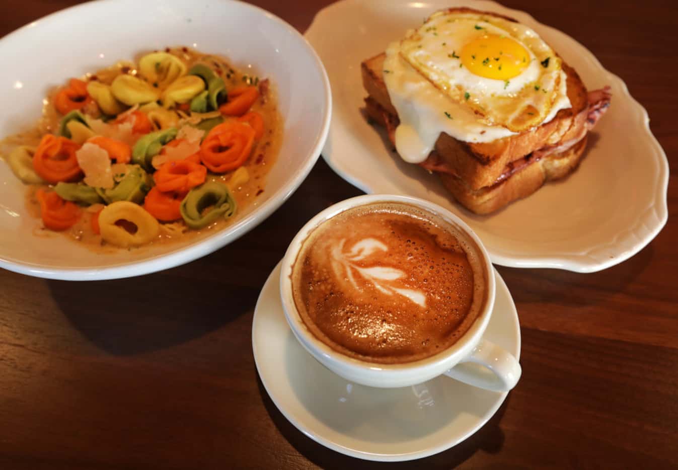 The spicy tortellini, clockwise from left, croquette madame, and the classic latte at Cafe...