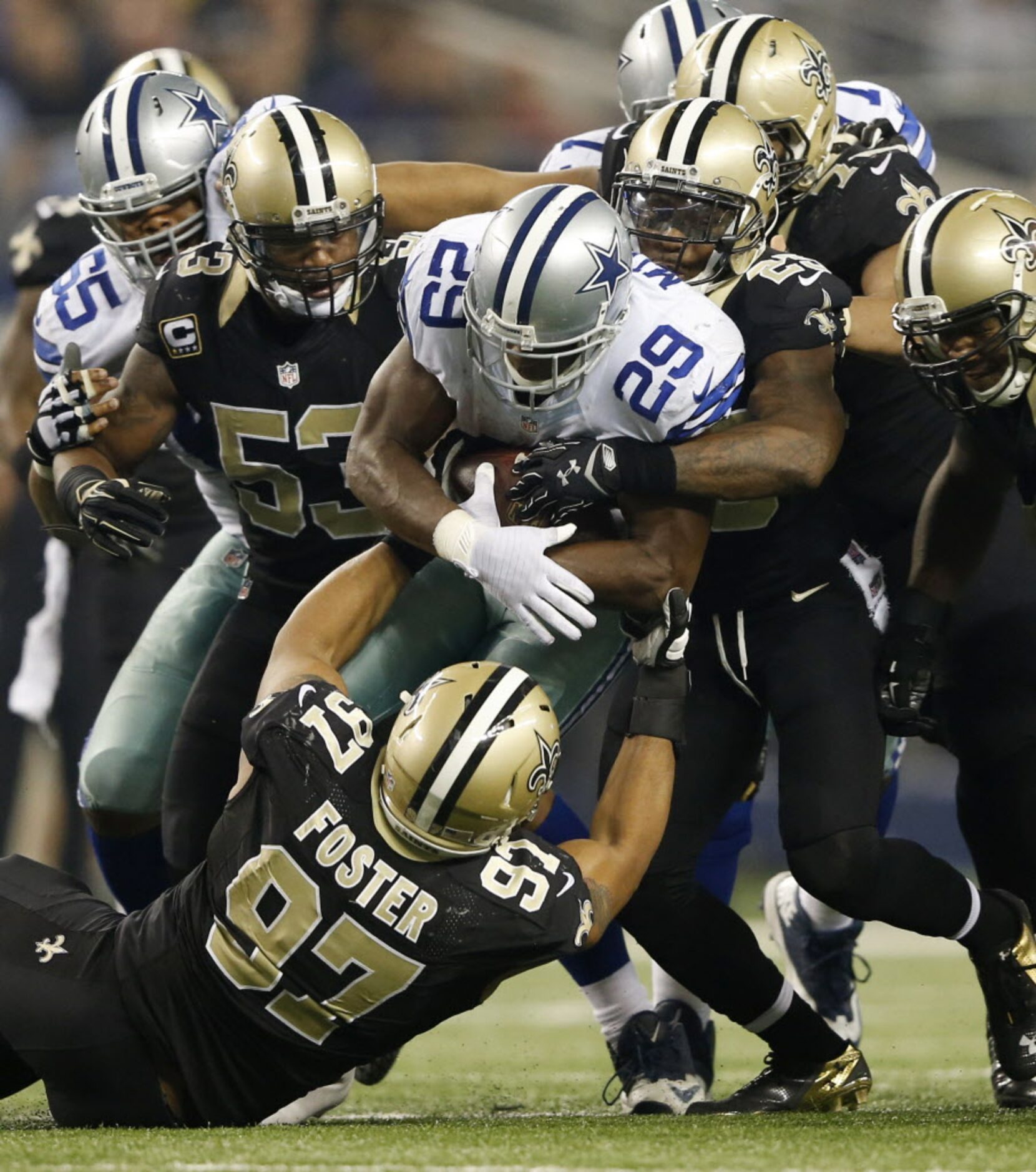 Dallas Cowboys running back DeMarco Murray (29) is stopped by New Orleans Saints free safety...