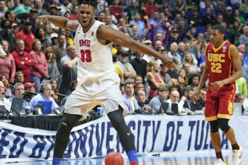 SMU forward Semi Ojeleye (33) celebrates the officials rewarding possession to the Mustangs...