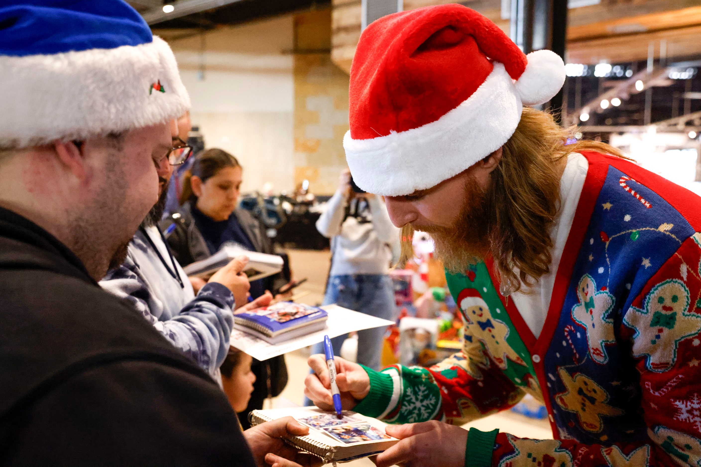 Texas Rangers pitcher Jon Gray gives autographs to fans during Texas Rangers Toy Drive on,...