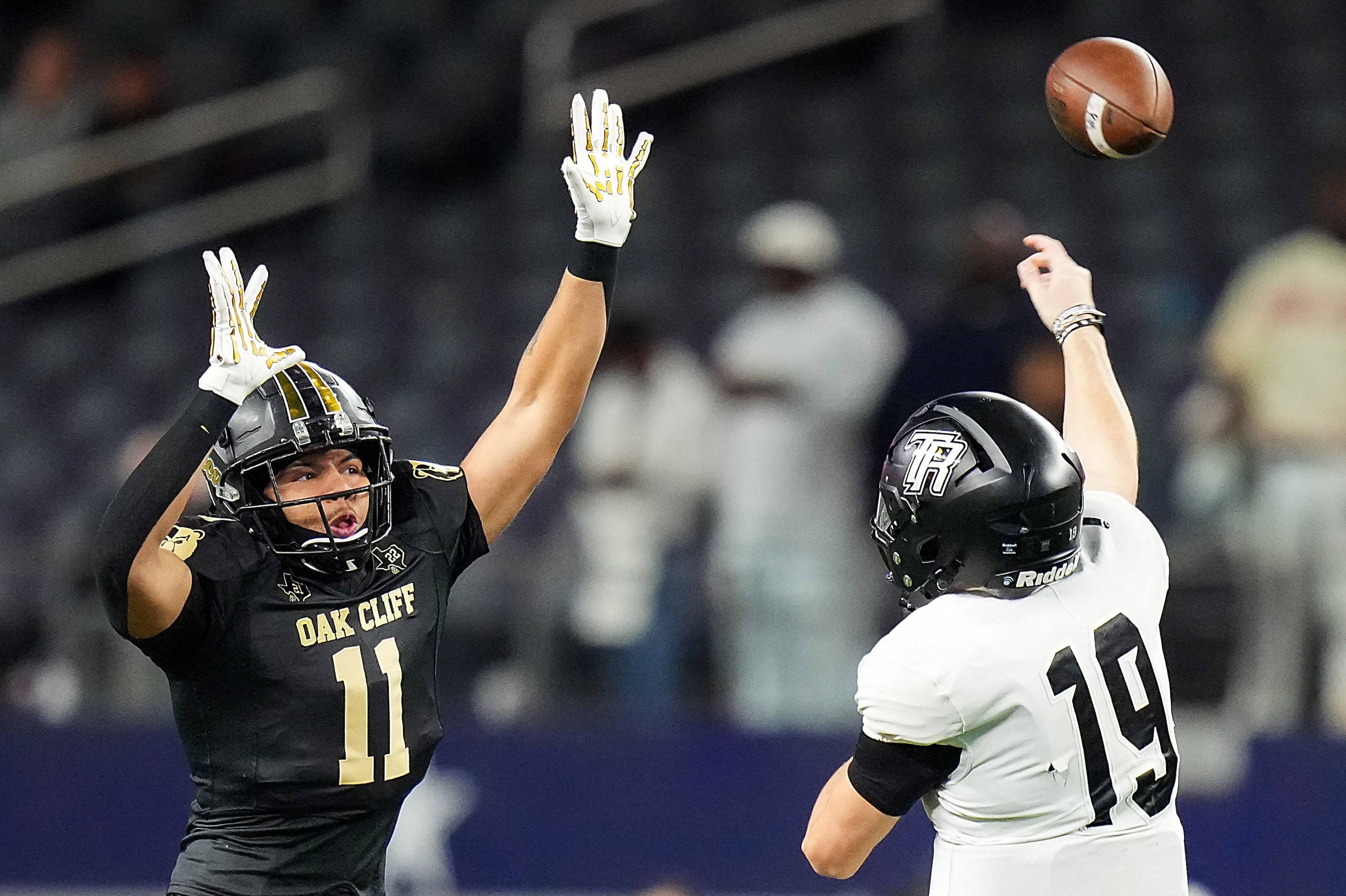 Richmond Randle quarterback Tyler Skrabanek (19) throws a pass over South Oak Cliff...