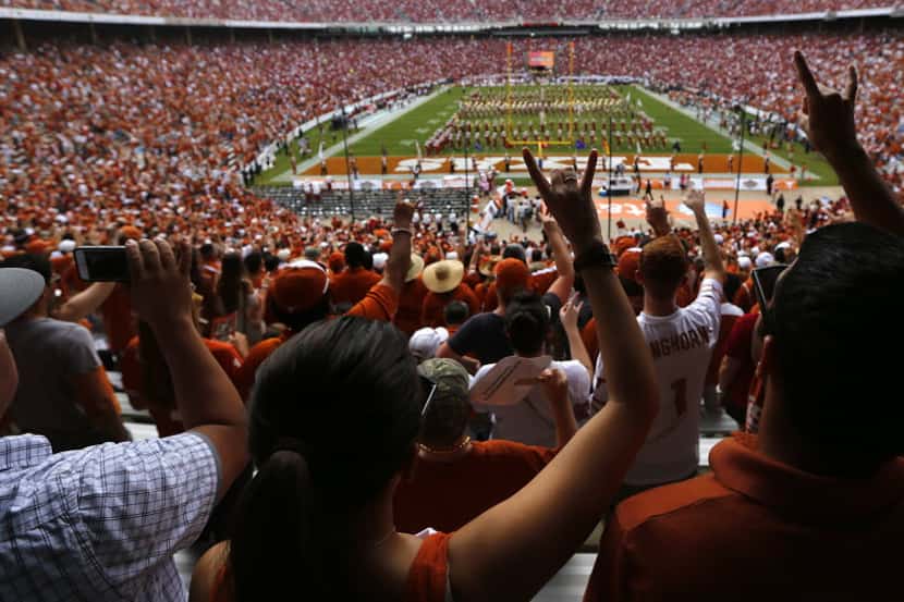 Texas Longhorns fans hook 'em horns as the UT band performs before the game against the...