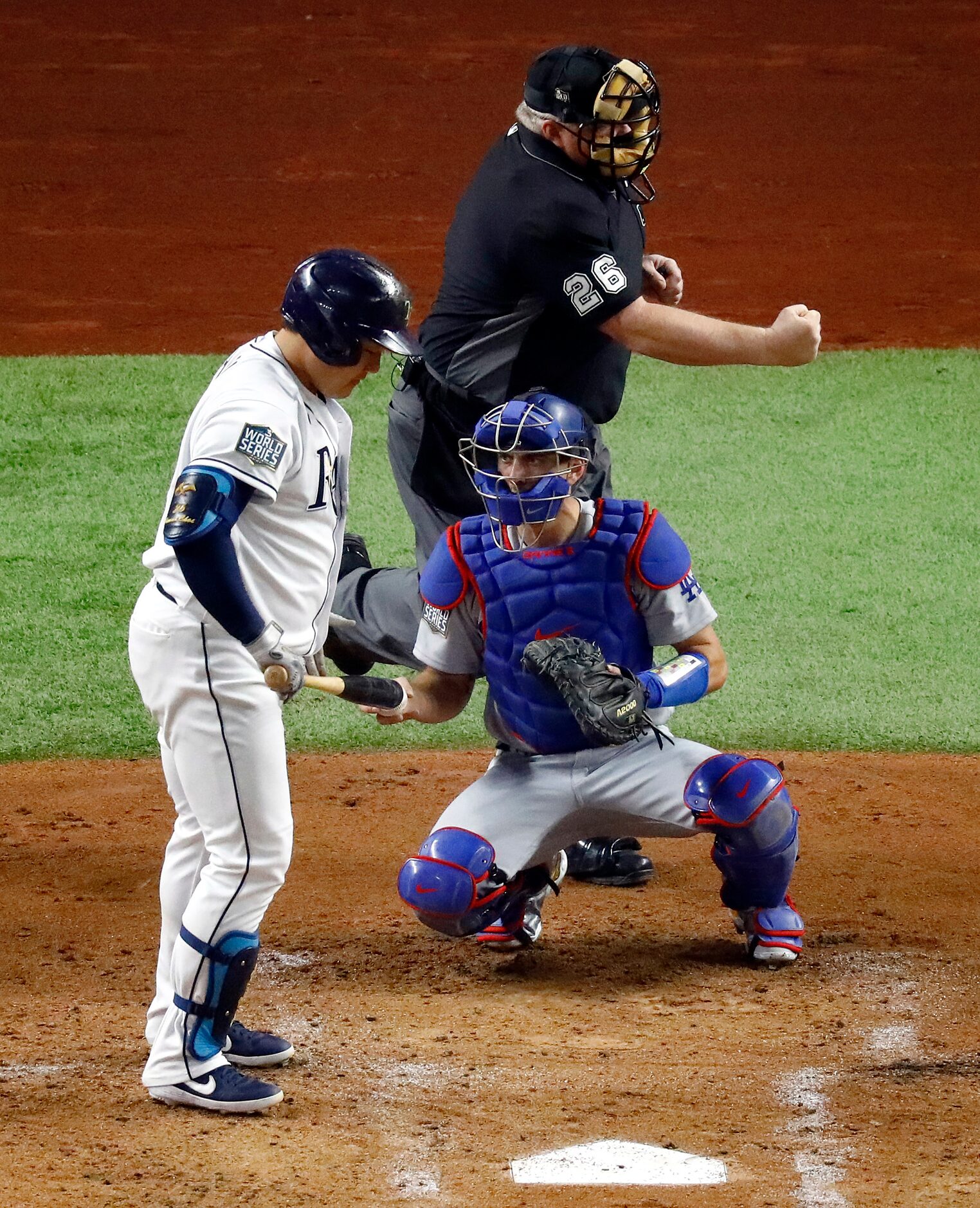 Home plate umpire Jabir Walker (26) calls Tampa Bay Rays first baseman Ji-Man Choi (26) out...