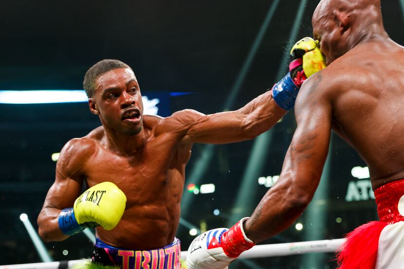 DeSoto’s Errol Spence Jr. hits Yordenis Ugás during a welterweight championship boxing match...