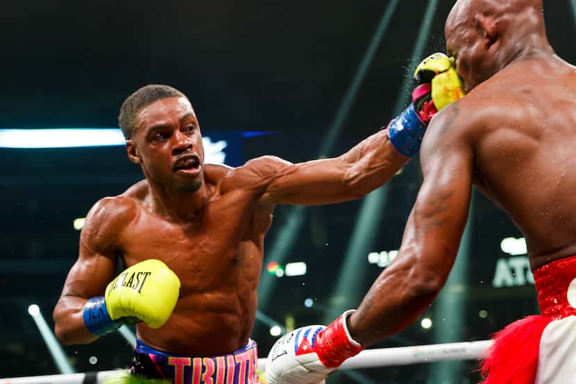 DeSoto’s Errol Spence Jr. hits Yordenis Ugas during a welterweight championship boxing match...