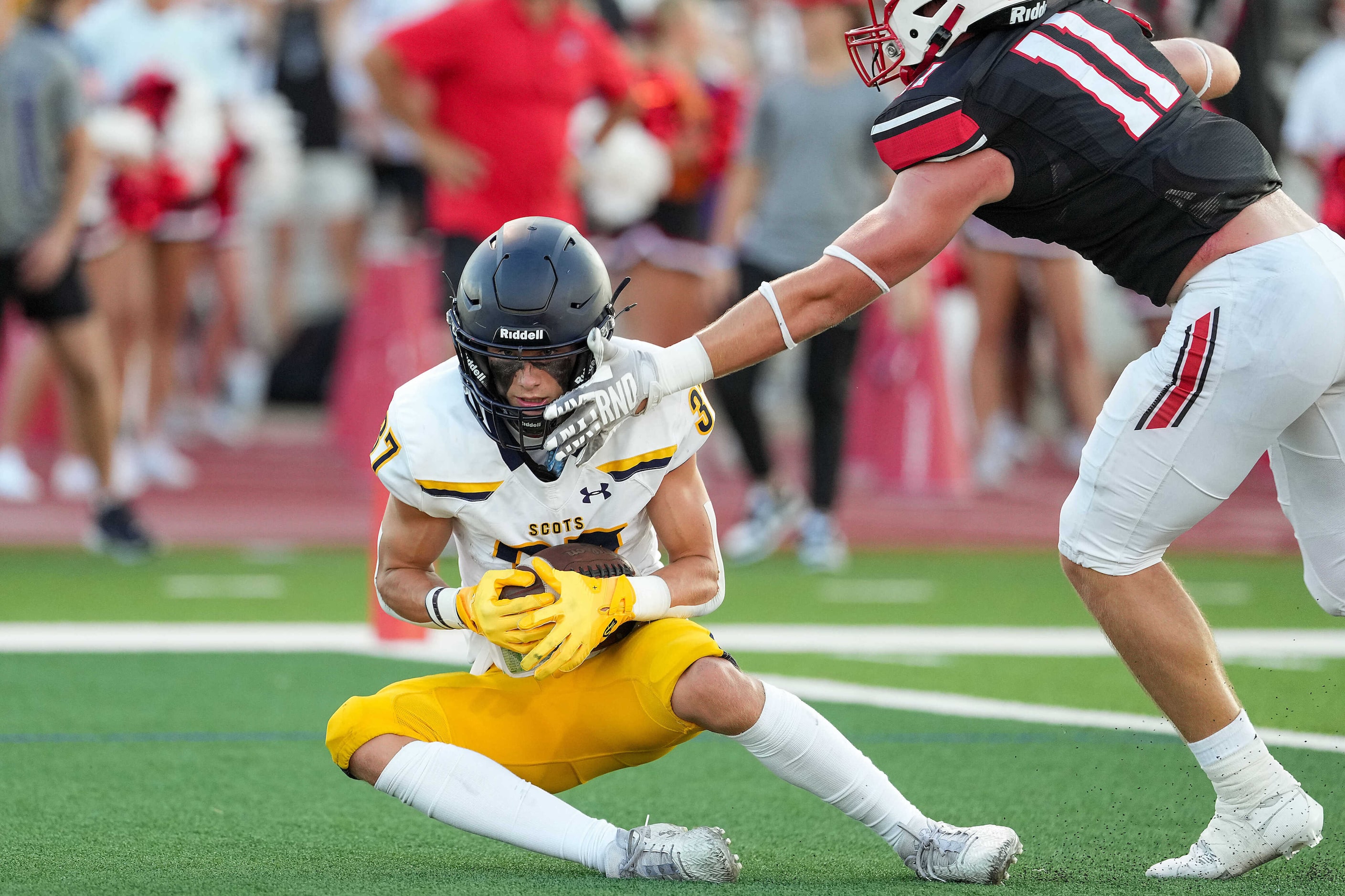 Highland Park wide receiver Cannon Bozman (37) catches a touchdown pass as Rockwall-Heath...