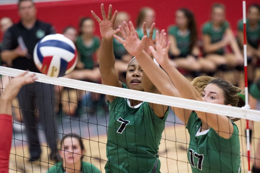 Southlake Carroll middle blocker Asjia O'Neal (7) and junior outside hitter Haley Hallgren...