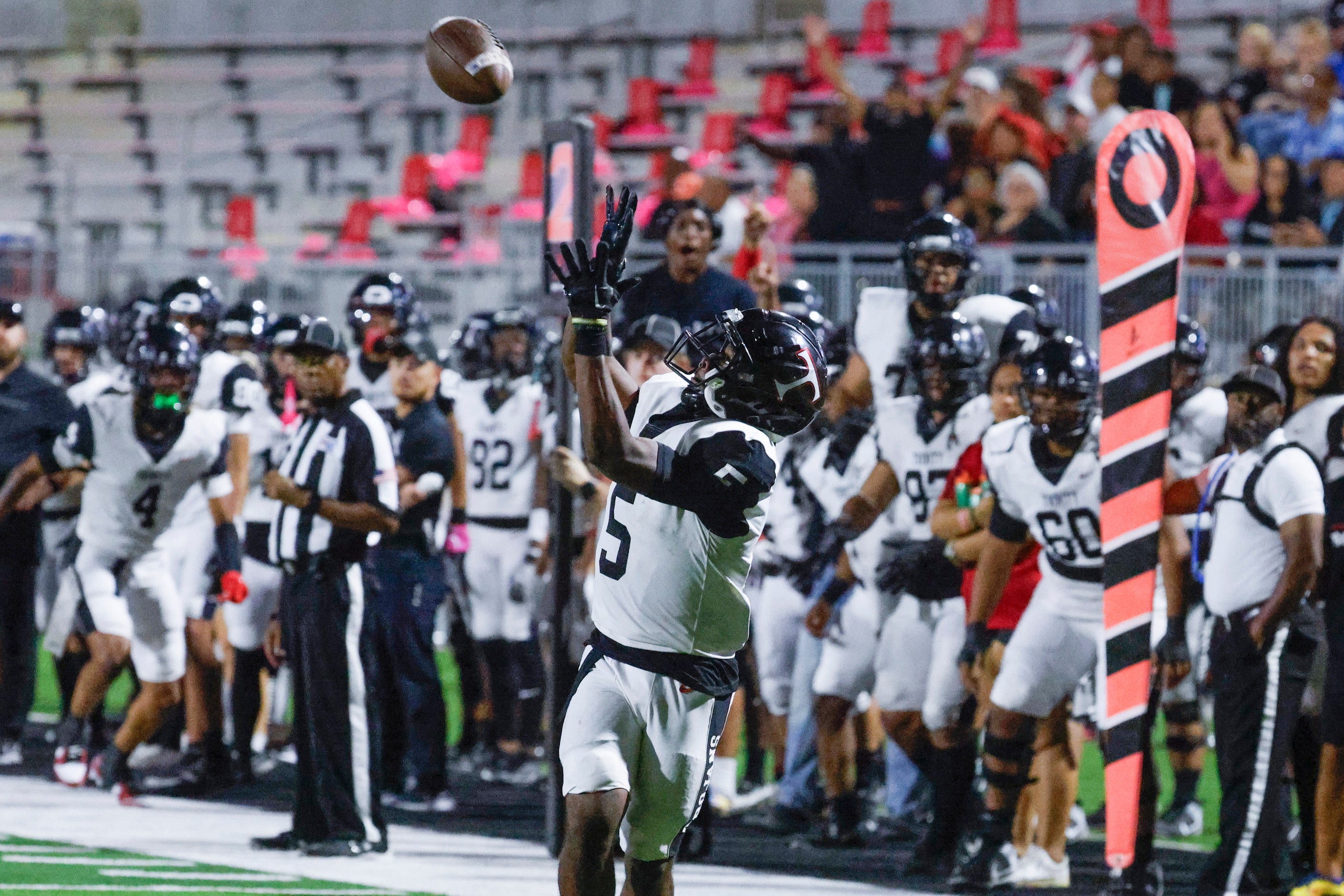 Trinity High’s Ethan Wright looks to catch a pass for a touchdown against Crowley High...