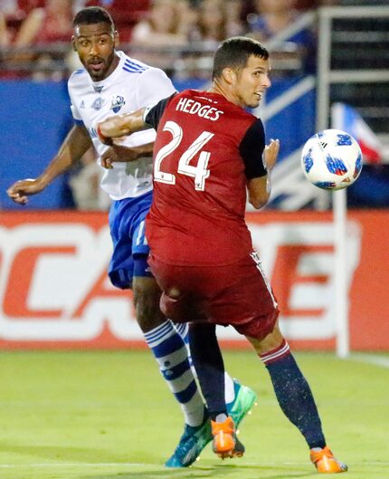 Montreal Impact forward Anthony Jackson-Hamel (11) and FC Dallas defender Matt Hedges (24)...