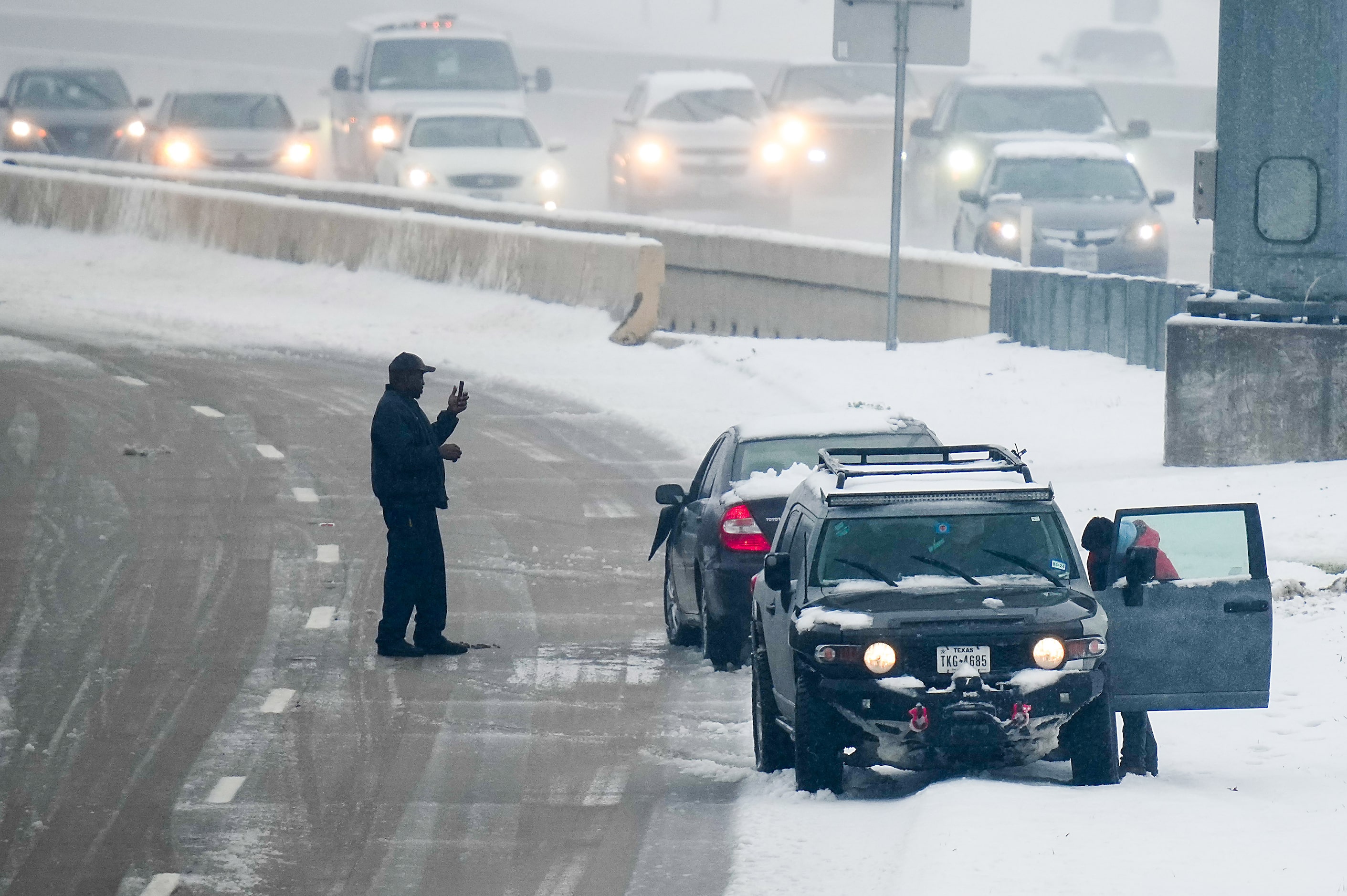 Motorist document an accident on the US-75 service road as a wintry mix of snow and rain...