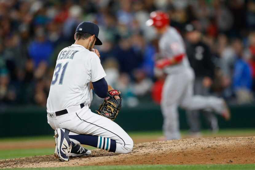 SEATTLE, WA - MAY 14:  Closing pitcher Steve Cishek #31 of the Seattle Mariners reacts after...