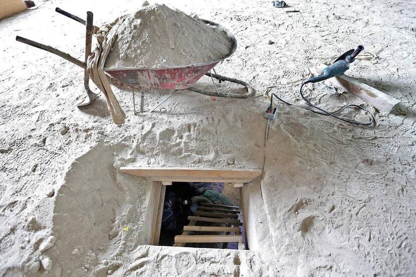 
A photo released by the attorney general of Mexico shows a tunnel opening in a house in...