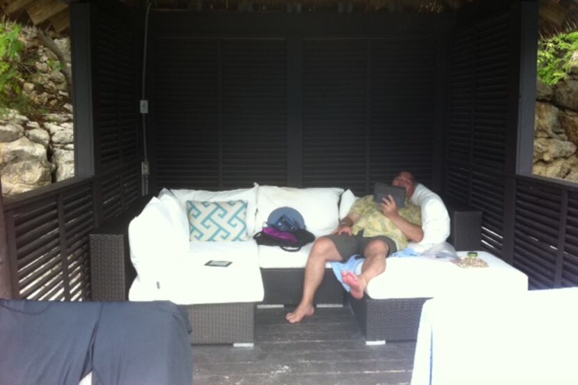  DMN editorial writer Michael Hashimoto loafing in a beachfront cabana the day before, in...