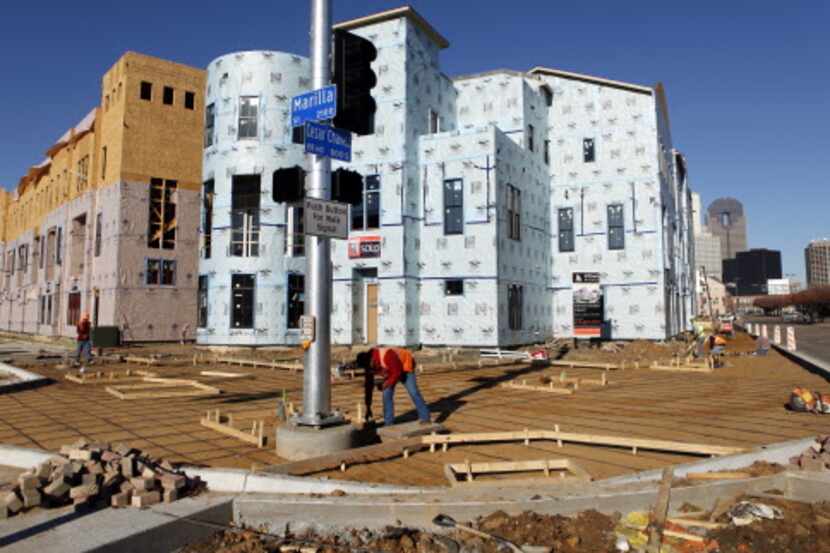 
Townhouses under construction at Marilla Street and Cesar Chavez Blvd. next to the Farmers...