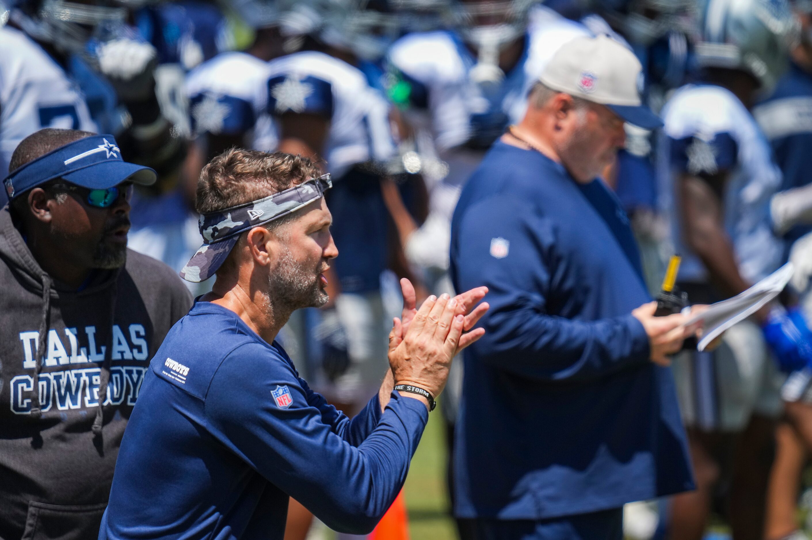 Dallas Cowboys offensive coordinator Brian Shottenheimer encourages his offense during a...