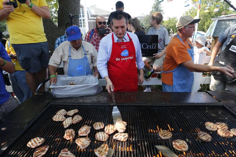  Sen. Ted Cruz cooks pork chops at the Iowa State Fair on Friday. (AP Photo/Paul Sancya)