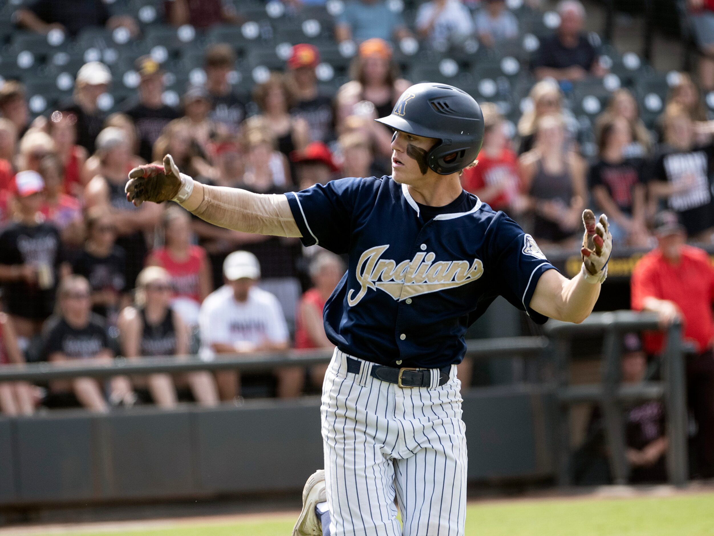 Keller Griffin Barton, (6), cheers on the bench after a first inning walk against...