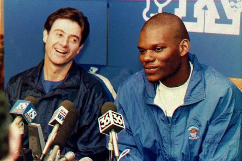 Kentucky's forward Jamal Mashburn, right, announces Thursday that he will forego his final...
