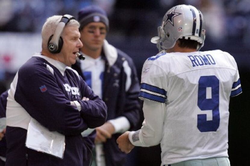 Cowboys QB Tony Romo talks with Head Coach Bill Parcells during a time-out on the last drive...