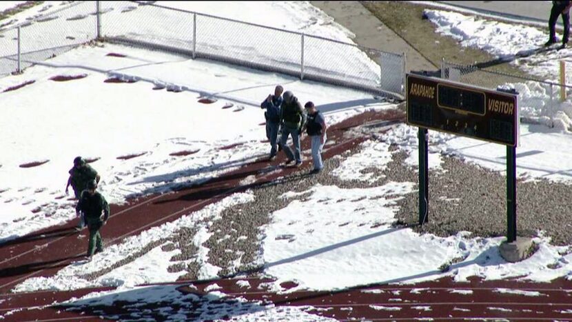 In this still image taken from video provided by Fox 31 Denver, police respond to reports of...