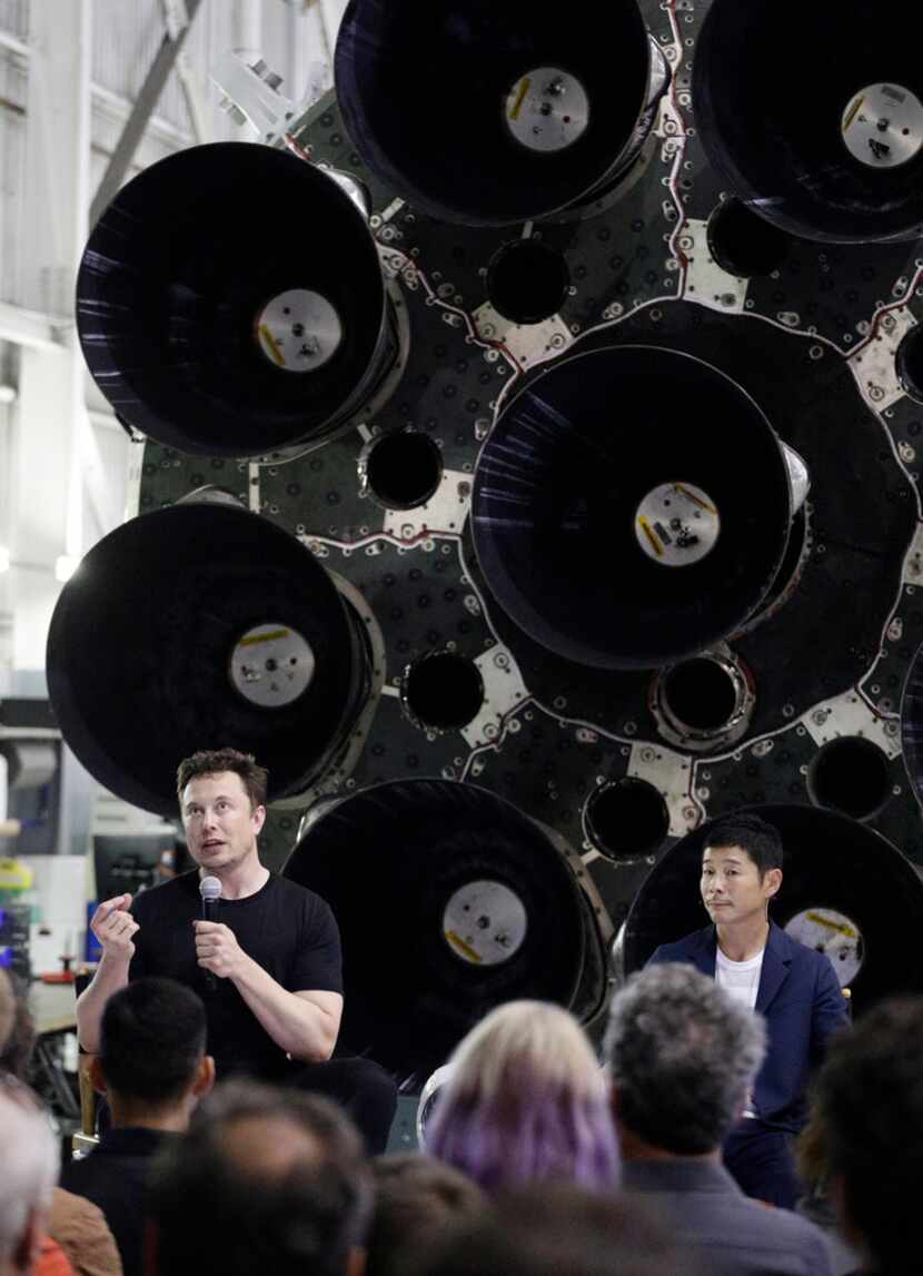 SpaceX founder and chief executive Elon Musk, left, speaks after announcing Japanese...