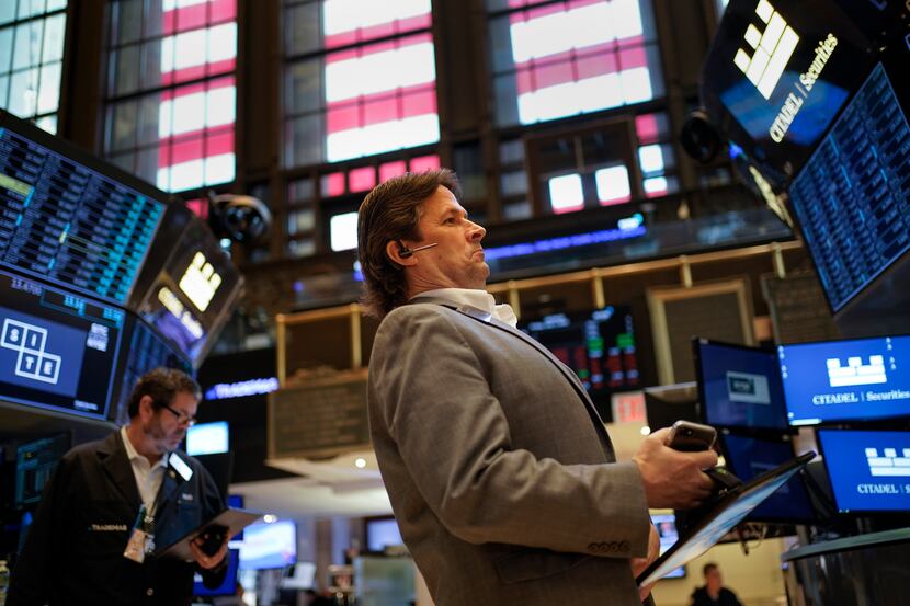 Traders work on the floor at the New York Stock Exchange in New York on July 1.